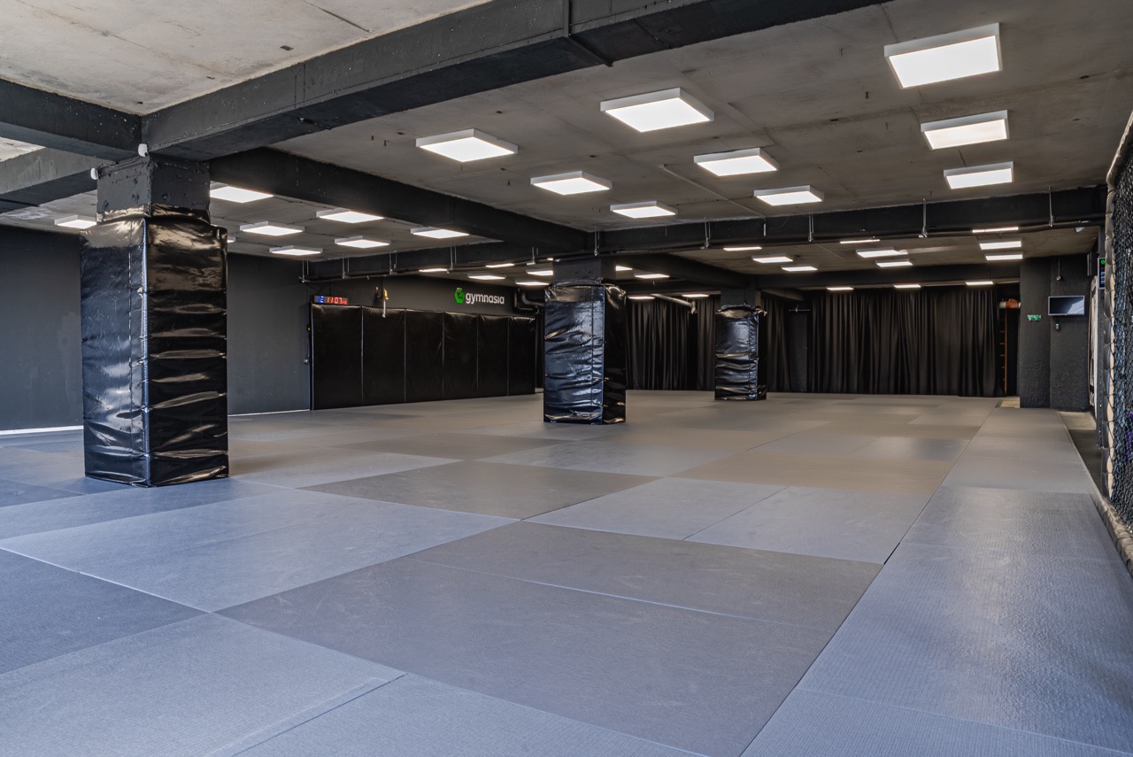 Kickboxing training mat space with open ring area